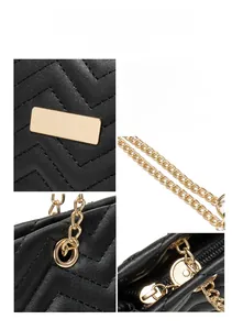 Macro details of black quilted bucket bag featuring golden chain and hardware accents
