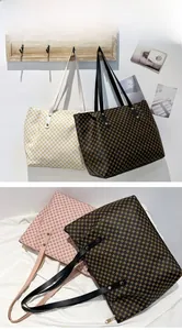 Detail of multi-color polka dot tote bags with zipper closure and slim leather handles