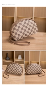 Detail of checkered letter pattern cosmetic pouch with leather strap and metal zipper