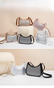 Detailed display of rhinestone shoulder bags in multiple colors with shimmering finish