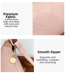 Detail of light pink quilted handbag featuring smooth gold zipper and premium leather texture