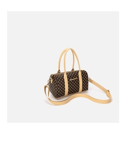 Detail of vintage Boston bag with circular pattern and detachable shoulder strap