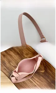 Pink quilted faux leather handbag with golden hardware and spacious interior view