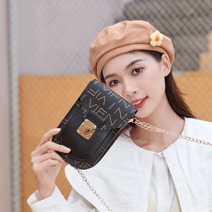 Petit sac à bandoulière noir pour téléphone avec chaîne dorée et motif V vintage