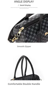 Detail of smooth gold zipper and comfortable black handles on vintage Boston handbag