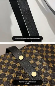 Detail of brown monogram tote bag showing soft leather shoulder strap and metal rivets