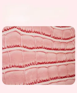 Close-up of the stylish pink faux leather bag featuring a detailed crocodile texture