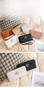 Detail of long quilted wallet for women with metal double ring buckle and wrist strap