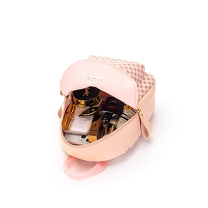 Pink mini backpack with diamond pattern flap showing spacious storage for daily essentials