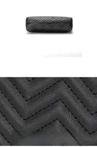 Detail view of black chevron quilted leather bucket bag bottom with precise stitching