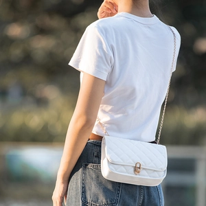 White quilted flap crossbody bag with gold chain and circular lock for women