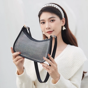 Chic black sequin underarm bag with sparkling silver rhinestones and golden hardware