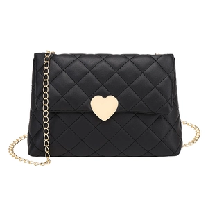 Quilted black crossbody bag featuring a golden heart lock and elegant chain strap
