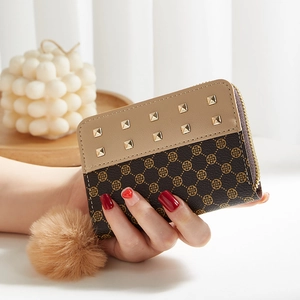 Short zipper wallet for women with rivet decor and plush ball charm in contrast colors