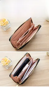 Detail of long black wallet with pink interior showing multi-compartment storage
