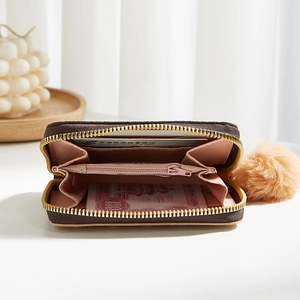 Mini brown floral card wallet with accordion slots and fluffy pompom keychain