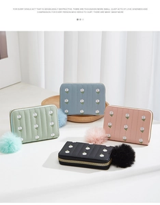 Mini floral embroidered coin purses in multiple colors with soft faux fur pompom charms