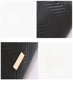 Detail of black quilted shoulder bag with wave stitching and gold metal hardware