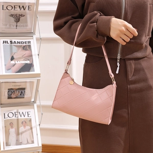 Pink quilted baguette shoulder bag for women with embossed pattern and gold pendant