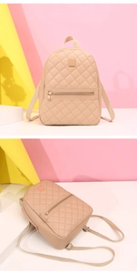 Dettaglio dello zaino trapuntato beige con inserti in metallo e spallacci regolabili