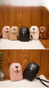Detailed view of mini PU leather shoulder bags with rhinestone mouse metal ornaments