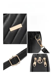 Close-up of golden hardware, quilted leather textures, and heart-shaped zippers on a black bag