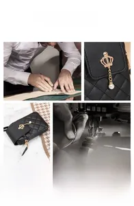 Detail of black quilted crossbody bag with gold crown pendant and pearl charm