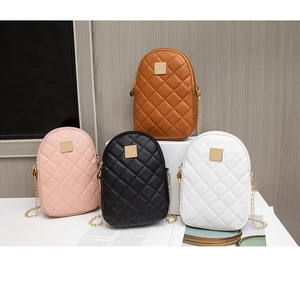 Quilted small crossbody phone bags in four colors with gold chain straps and metal plaques