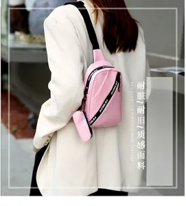 Pink nylon chest bag for women with black logo strap and detachable round coin purse