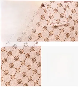 Detail of pink PU leather crossbody bag showing clover pattern and fine stitching texture