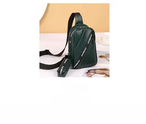 Detail of green PU leather sling bag with FIRIGHT strap and small matching coin purse