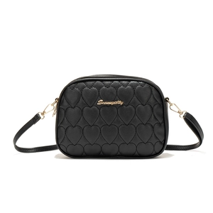 Black heart-quilted PU leather camera bag with gold logo and adjustable shoulder strap
