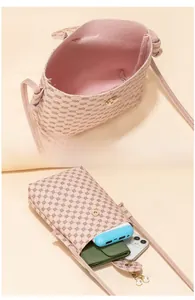 Pink printed crossbody phone bag showing magnetic closure and interior storage capacity