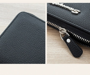 Detailed view of black lychee grain leather wallet with silver metal zipper and logo