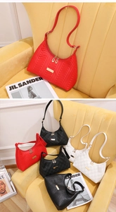 Quilted faux leather underarm bags in red, black, and white with golden hardware details