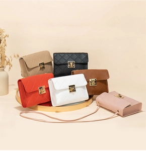 Detailed arrangement of quilted shoulder bags in six vibrant colors with gold twist locks