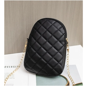 Close-up of quilted black faux leather mini square bag with premium gold chain strap