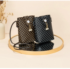 Detail view of mini crossbody phone bags with pearl cat buckle and vintage print