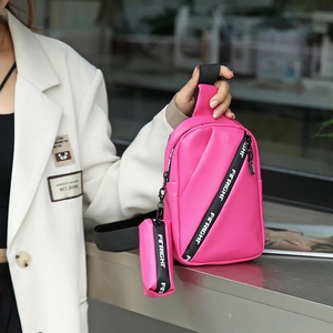 Pink faux leather crossbody chest bag with adjustable strap and mini coin purse for women