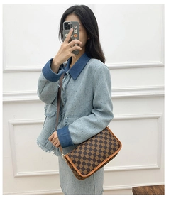 Brown checkered crossbody bag with letter S pattern and leather trim detail