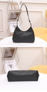 Close-up of black V-quilted shoulder bag with elegant gold hardware and bottom details
