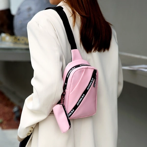 Pink multi-functional crossbody bag for women with mini pouch on a wide nylon strap