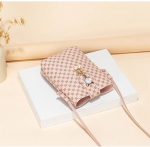 Pink printed crossbody phone bag featuring a pearl cat-ear charm and floral pattern