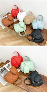 Detail of Boston handbag set with quilted texture and matching mini purse in various colors