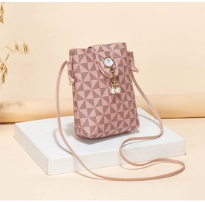 Detail of pink geometric crossbody phone bag with cat-ear clasp and pearl tassels
