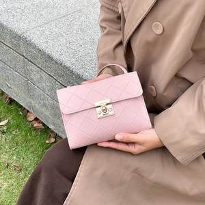 Pink quilted square crossbody handbag with gold clasp and top handle for women