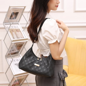 Chic black quilted hobo shoulder bag with gold zipper and embossed texture for women