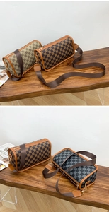 Close-up of retro cylinder shoulder bags with checkerboard pattern and wide straps