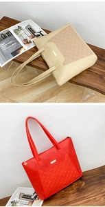 Macro detail of quilted faux leather tote bag with gold metal zip and chic decorative tag