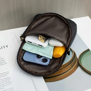 Compact black quilted crossbody phone bag with multi-pocket storage for daily essentials